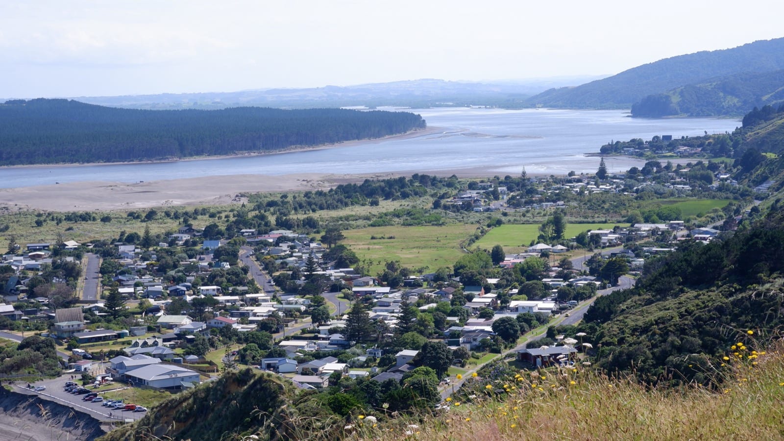 Port Waikato township and the Waikato River mouth seen from the hills above.
