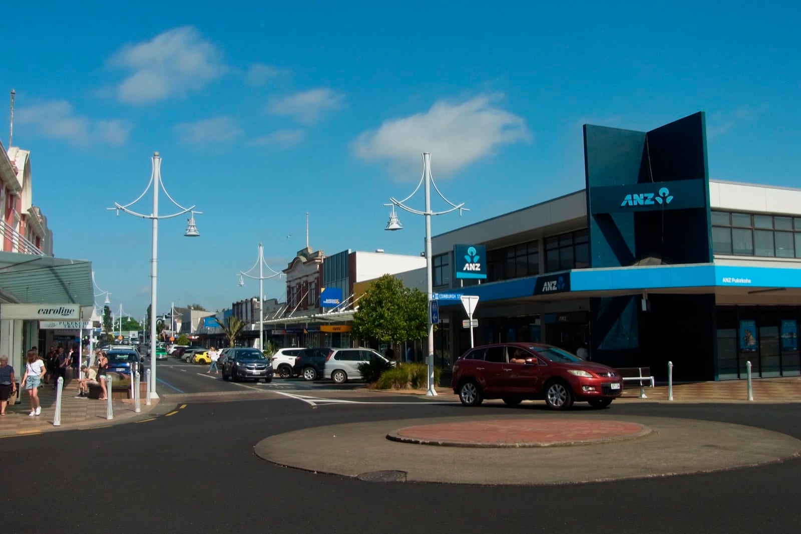 King Street roundabout and heritage shopfronts in central Pukekohe on a clear day.